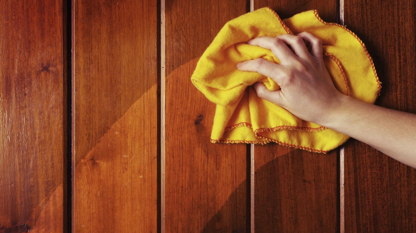 Wiping floor with yellow cloth