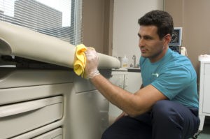 Person Cleaning hospital bed