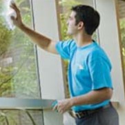 A man cleaning a window