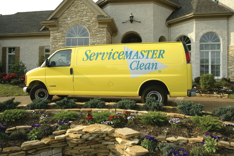 servicemaster clean van outside a home